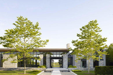 Huge modern stone house exterior idea in New York