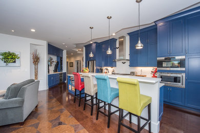 Open concept kitchen - modern galley cork floor and brown floor open concept kitchen idea in Other with an undermount sink, recessed-panel cabinets, blue cabinets, quartz countertops, white backsplash, porcelain backsplash, stainless steel appliances and an island