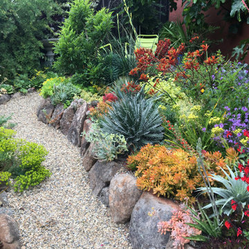 Gravel path leads to peek-a-boo sitting area