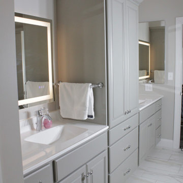 Intellectual Grey double vanity with white cultured marble and a linen tower