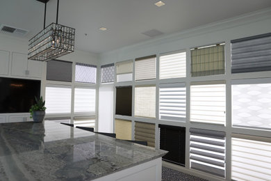 Example of a large transitional galley carpeted wet bar design in San Francisco with white cabinets, granite countertops, gray countertops and shaker cabinets