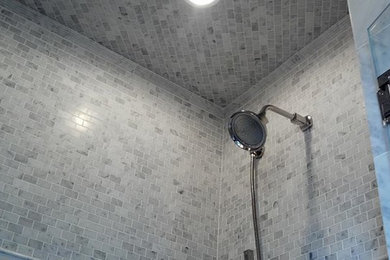 Inspiration for a bathroom in New York with a corner shower, white tile and mosaic tile.