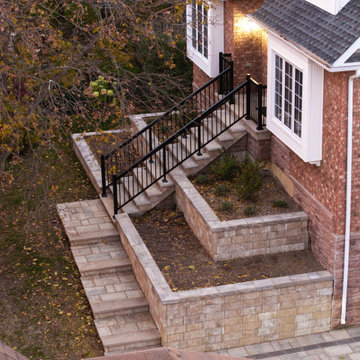 Custom Front Entrance Stonework & Retaining Wall Landscape Design