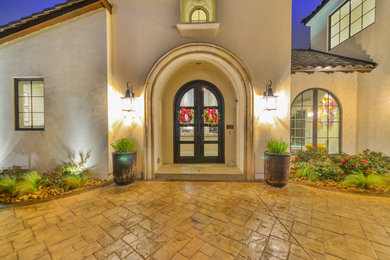Example of a large eclectic white two-story stucco exterior home design in Austin with a hip roof