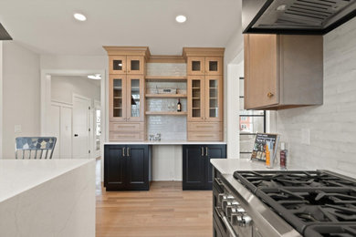 Inspiration for a transitional kitchen remodel in Boston with recessed-panel cabinets