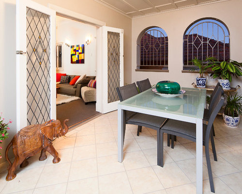 Eclectic Porch Brisbane Inspiration for a mid-sized eclectic screened-in front porch remodel in Brisbane with