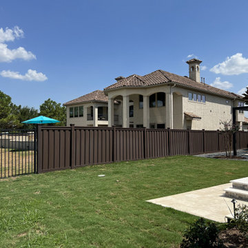 Dark Brown Composite Trex Fence and Black Iron Fence