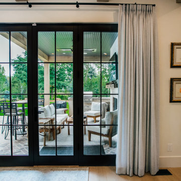 Functional drapes with 2-Finger Pinch Pleat on a Matte Black Traverse Rod
