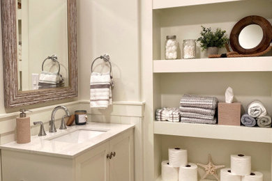 Inspiration for a mid-sized coastal kids' ceramic tile ceramic tile, gray floor and single-sink bathroom remodel in New York with shaker cabinets, a one-piece toilet, beige walls, an undermount sink, white countertops and a built-in vanity