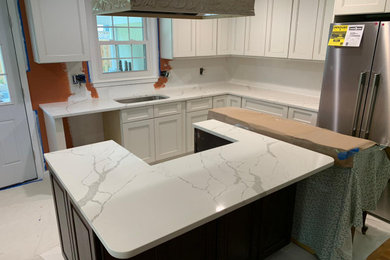 Example of a kitchen design in DC Metro with a drop-in sink and two islands