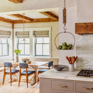 Country light wood floor and beige floor dining room photo in Boston with beige walls