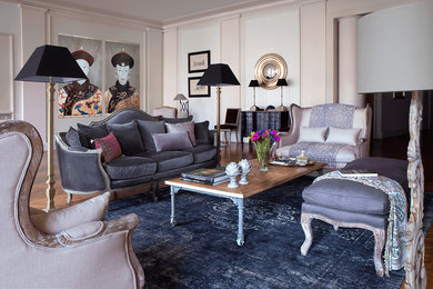 Design ideas for a traditional enclosed living room in Paris with pink walls, dark hardwood floors and brown floor.
