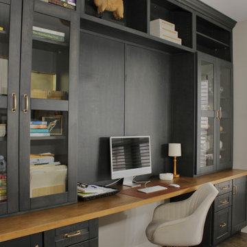 Home office with clean cabinetry, integrated storage, and a functional layout