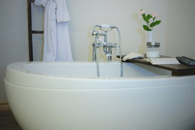 Bathroom - transitional vinyl floor bathroom idea in Toronto with an undermount sink, shaker cabinets, white cabinets, marble countertops, a two-piece toilet and white walls