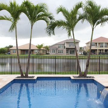 Custom Pool & Spa with Partially Raised Spa, and Fire Bowls in Boynton Beach