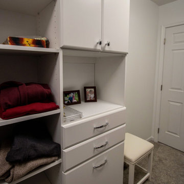 White Vanity with Freestanding Tub and Tiled Shower with Closet Storage