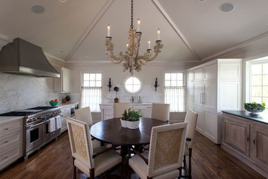 Eat-in kitchen - transitional u-shaped medium tone wood floor and brown floor eat-in kitchen idea in Nashville with an undermount sink, recessed-panel cabinets, white cabinets, marble countertops, marble backsplash, stainless steel appliances and no island