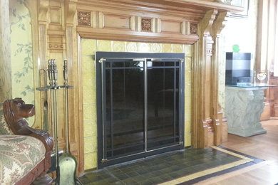 Example of an ornate formal light wood floor living room design in Other with multicolored walls, a standard fireplace and a tile fireplace