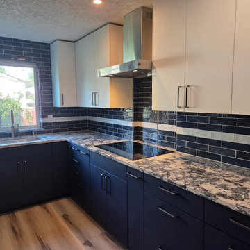 Blue and White Kitchen with Tiled Pass Through