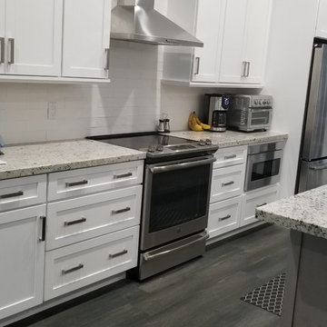 Two Toned Kitchen Full Remodel featuring White & Gray Cabinetry and Granite tops