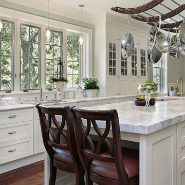 Contemporary Style in Bright White Complimented with White Quartz Counter Tops.