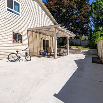 Concrete Backyard Patio and Pergola Outdoor Living Space – Coquitlam Renovation