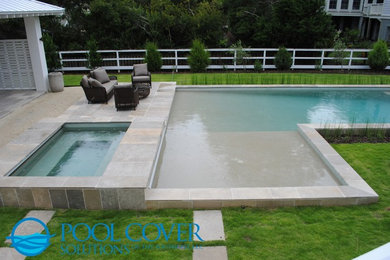 Large beach style backyard l-shaped hot tub photo in Charleston