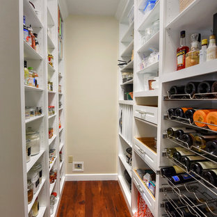Mid-sized traditional kitchen pantry inspiration - Kitchen pantry - mid-sized traditional galley dark wood floor kitchen pantry idea in Jacksonville with wood countertops and stainless steel appliances