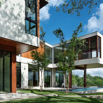 Modern home with cantilevered Internet Cafe and kid play area, modern lap pool,