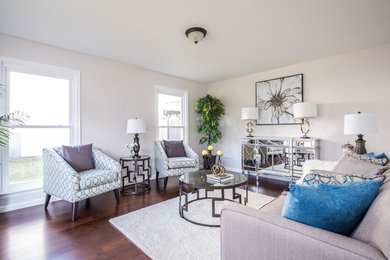 Inspiration for a mid-sized contemporary formal and enclosed dark wood floor and brown floor living room remodel in New York with beige walls, no fireplace and no tv