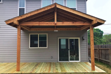 Inspiration for a mid-sized rustic backyard patio remodel in Austin with decking and a gazebo