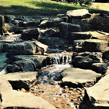 Pondless Water Feature/Flagstone Patio and Fire Pit/Mossrock Seating Wall