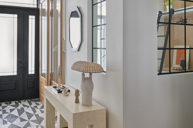 Inspiration for a contemporary ceramic tile entryway remodel in Toronto with a black front door