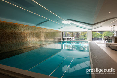 Design ideas for a modern back swimming pool in Essex.