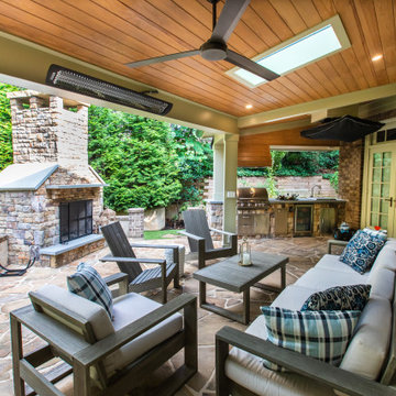 Covered Outdoor Living Area with Fireplace, Grill Station & Lounge Seating