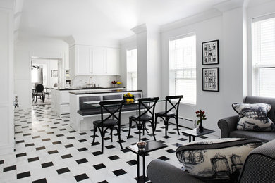 Open concept kitchen - large transitional u-shaped marble floor, multicolored floor and tray ceiling open concept kitchen idea in Chicago with recessed-panel cabinets, white backsplash, a double-bowl sink, limestone backsplash, stainless steel appliances, a peninsula and black countertops