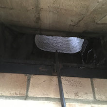 Indoor Grill with brick chimney present