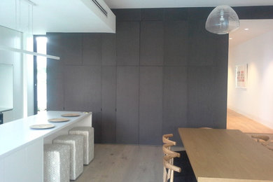 Photo of a large modern l-shaped eat-in kitchen in Melbourne with with island.