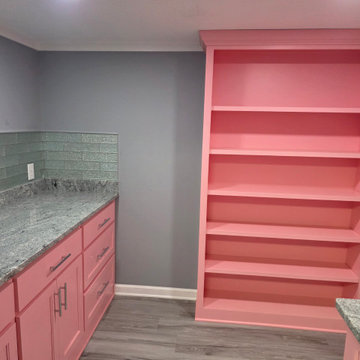 Extended Pink Kitchen with Built-In Shelving