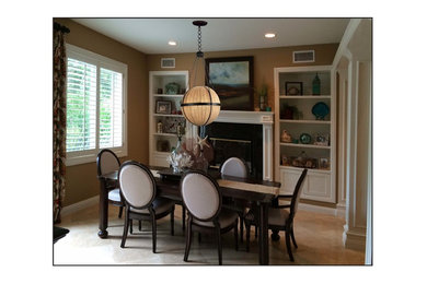 Inspiration for a mid-sized transitional ceramic tile enclosed dining room remodel in Orange County with brown walls and a standard fireplace