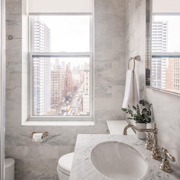 Secondary Bathroom with Marble Vanity and City Views