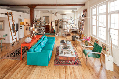 Living room - eclectic open concept light wood floor living room idea in Richmond with white walls and no fireplace