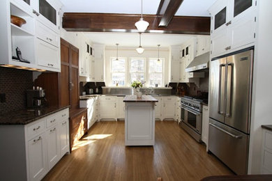 Inspiration for a mid-sized timeless u-shaped medium tone wood floor eat-in kitchen remodel in Minneapolis with an integrated sink, recessed-panel cabinets, white cabinets, marble countertops, brown backsplash, stainless steel appliances and an island