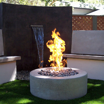 Waterfeatures, very modern water feature, seating area, and fireplace
