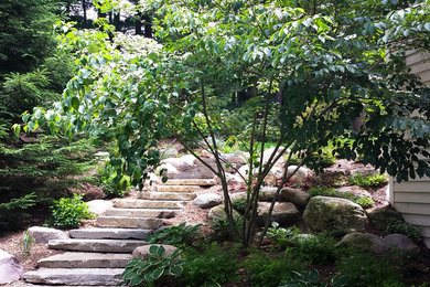 Photo of a mid-sized traditional partial sun backyard garden path in Grand Rapids.