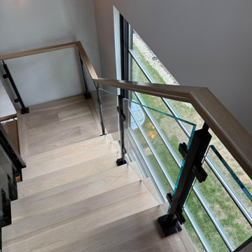 Project #136 | Modern Floating Staircase Encircling Glass Elevator