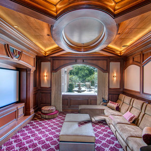 Inspiration for a mid-sized timeless enclosed carpeted and multicolored floor home theater remodel in San Diego with a projector screen