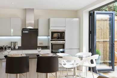 Mid-sized trendy home design photo in Surrey