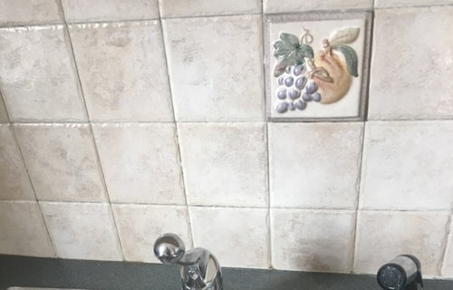 How to cover up ugly raised tiles in my new rental kitchen?
