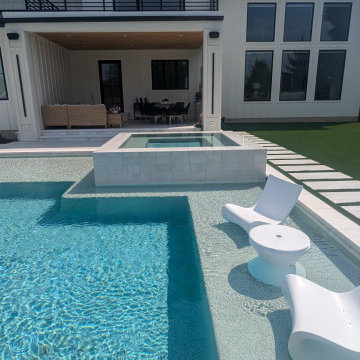 Lewes, DE - Modern, Clean Line Pool with Large Tanning Ledge & Elevated Spa